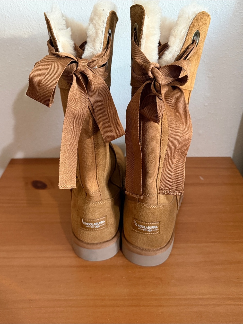 Koolaburra tan suede shearling-lined ribbon back boots